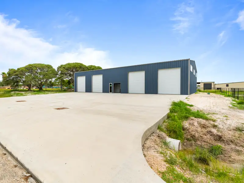 5,700 Sq Ft Warehouse on ½ Acre in Rockport, Texas with Highway Access and Parking
