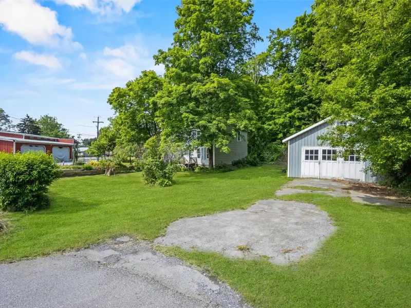 Commercial Retail/warehouse with Charming Colonial Home in High-traffic Corner Location
