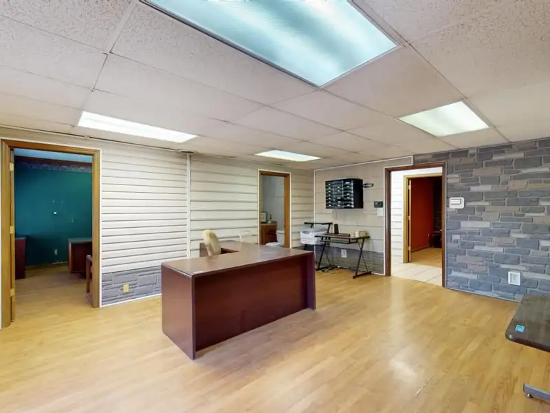 Commercial Property on Busy Highway - 2.1 Acres, 31,000 Sq Ft with Offices and Roll-up Doors