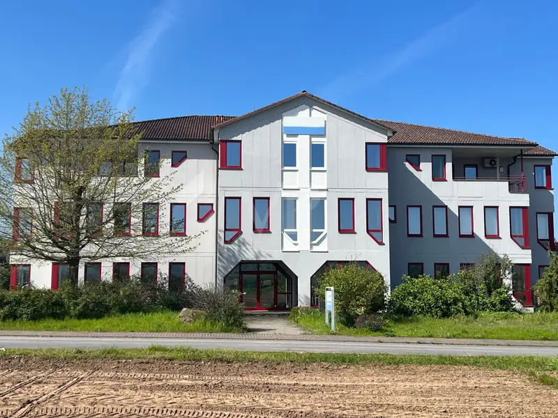 Versatile Company Building with Apartments, Offices, and Storage in Prime Location