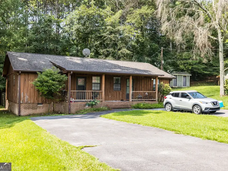 27 Acres with 2,400 Sq. Ft. Home, Duplexes, Pool, and Barn in Prime Location