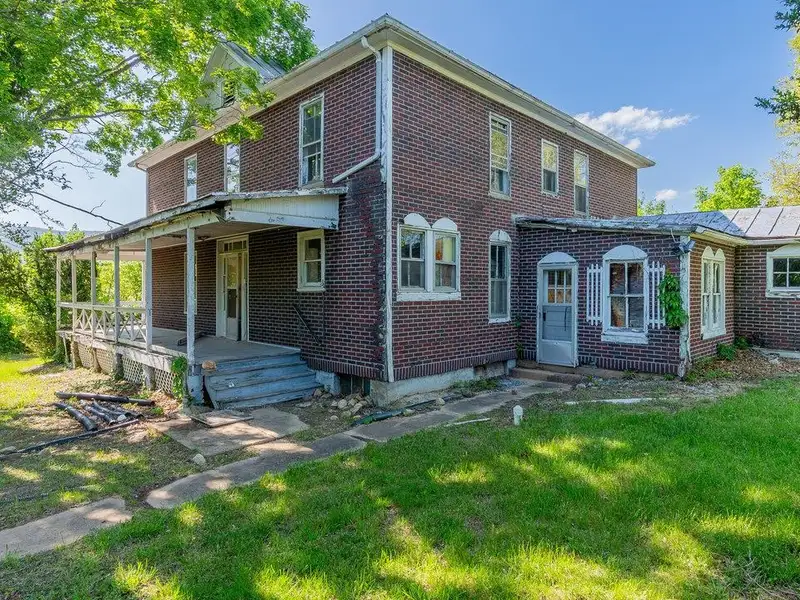 Classic American Foursquare Home in Need of Restoration with Detached Garage