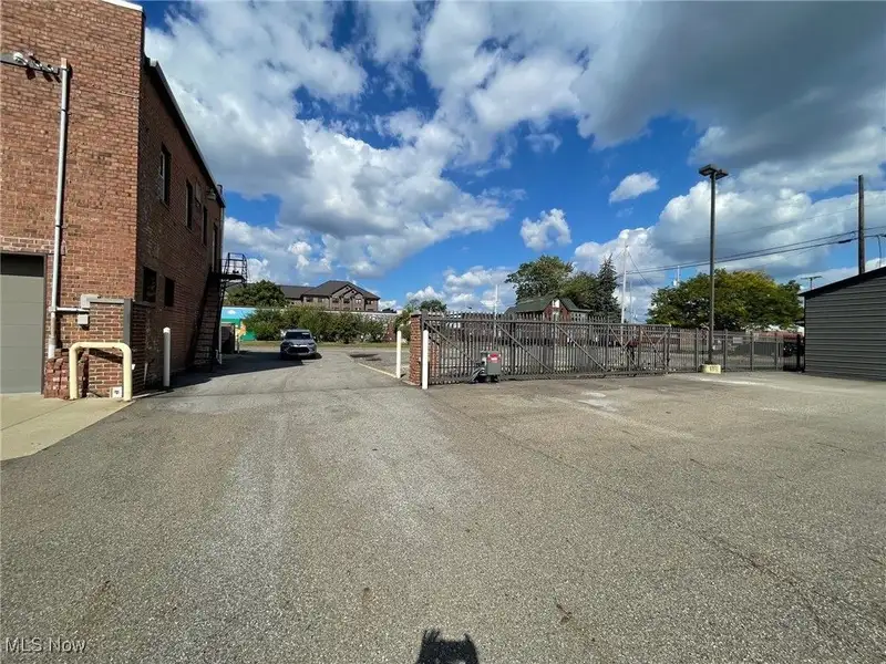 Well-maintained Two-story Brick Building with Retail and Workshop Space in Ne Location
