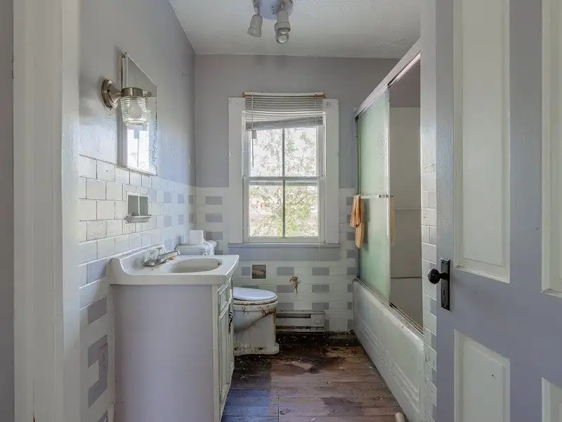 Classic American Foursquare Home in Need of Restoration with Detached Garage