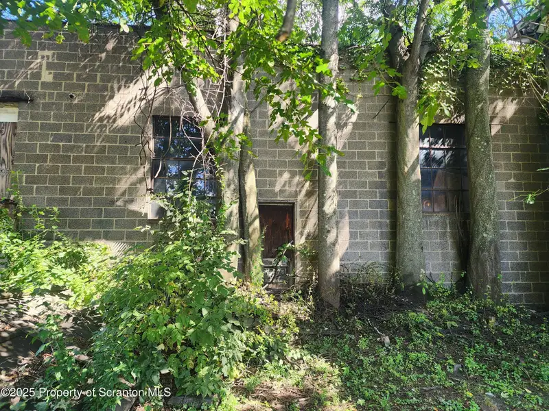 Versatile Commercial Property with Garage Bays and Billboard Income in Prime Location