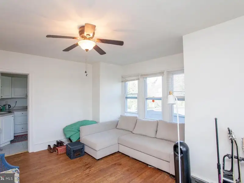 Multi-unit Building with Commercial Space and Two Residential Apartments in Established Location