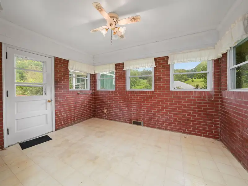 Prime 2.58-acre Multifunctional Property with Ranch Home and Outbuildings Near High-traffic Area