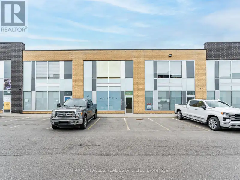 Fully Leased Commercial Condo in Prime Location on the Queensway