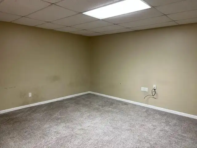 Versatile Commercial Property with 6000 Sq Ft Building and One-bedroom Apartment in Prime Location