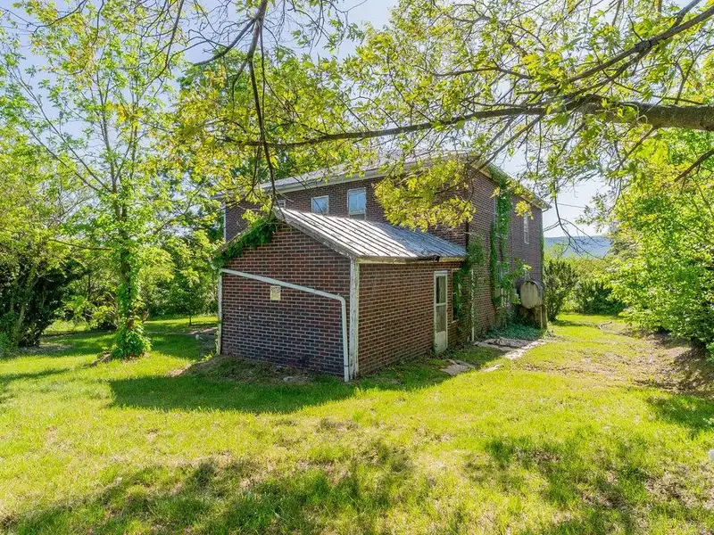 Classic American Foursquare Home in Need of Restoration with Detached Garage