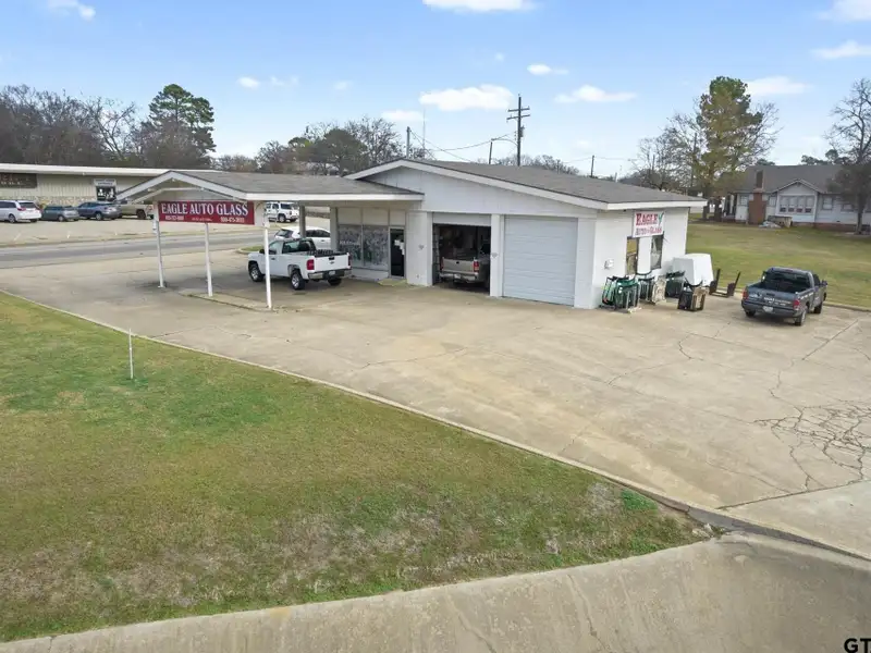 Prime Commercial Property with Building and Home on Half Acre Lot