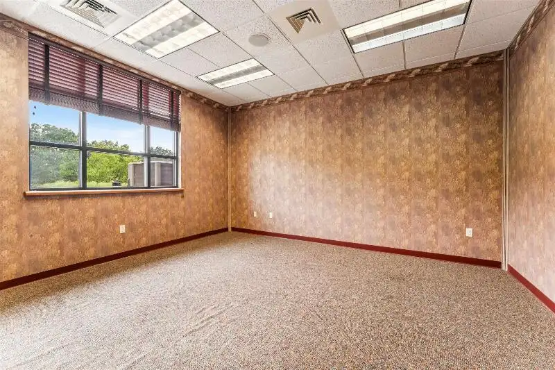 Versatile Commercial Condo for Sale Near Hwy 151 & 41 with Multiple Offices and Amenities
