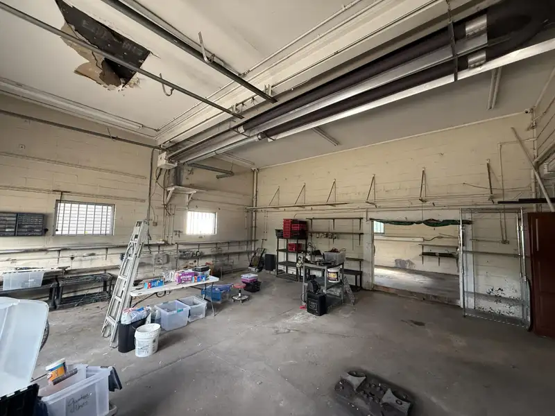 Prime Commercial Property with Office and Garage Space at Lake and East Main Intersection