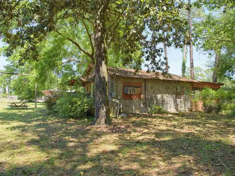 Corner Lot with Log Cabin Ideal for Restaurant or Business in High Visibility Area