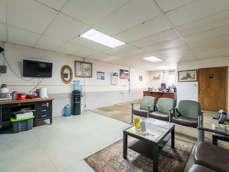 Mixed-use Property with 1-bedroom Apartment in Well-maintained Building