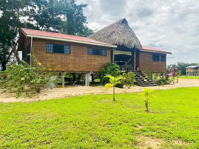 Riverfront 30-acre Farm with Sustainable Living and Rustic Main House in Belize