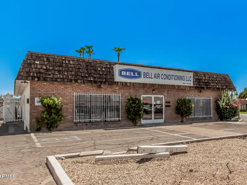 Versatile Commercial Property with Two Buildings and Ample Parking in Prime Location