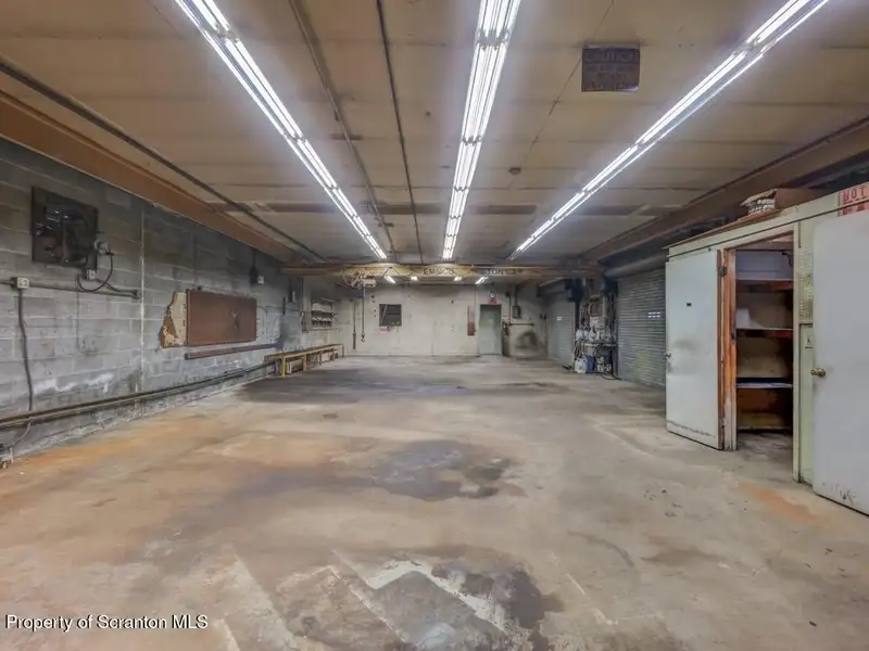 Mixed-use Property in Throop: 7-bay Garage and Updated 2-bedroom Apartment