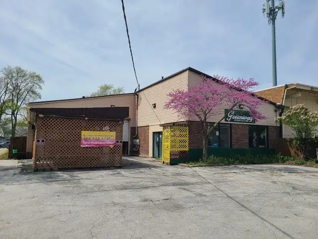 Versatile Commercial Space with Fenced Parking and Service Amenities