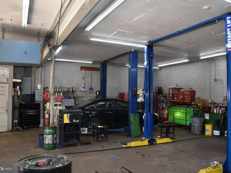 Versatile 3000+ Sq Ft Commercial Space in Prime Village Location with Auto Repair Facilities
