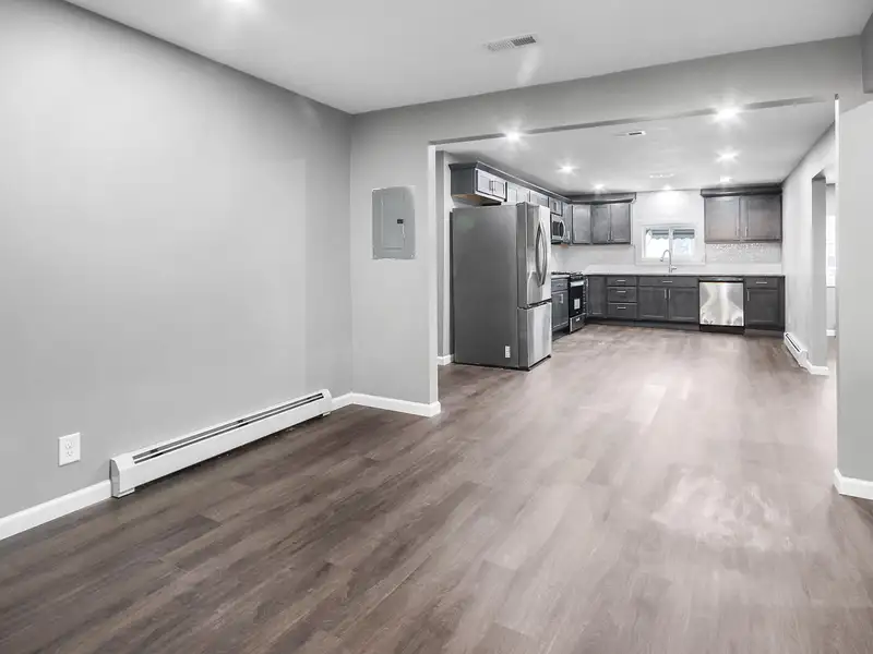 Mixed-use Two Unit Building with Remodeled Three Bedroom Apartment in Prime Location