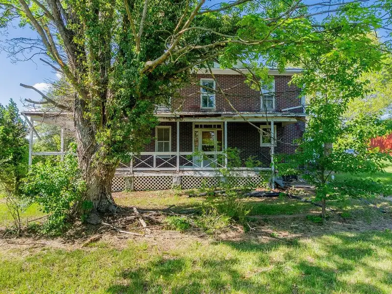 Classic American Foursquare Home in Need of Restoration with Detached Garage