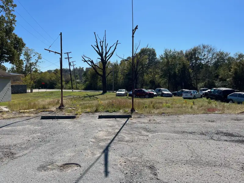 Commercial Land with Building for Sale in Prime Location - 0.6 Acres