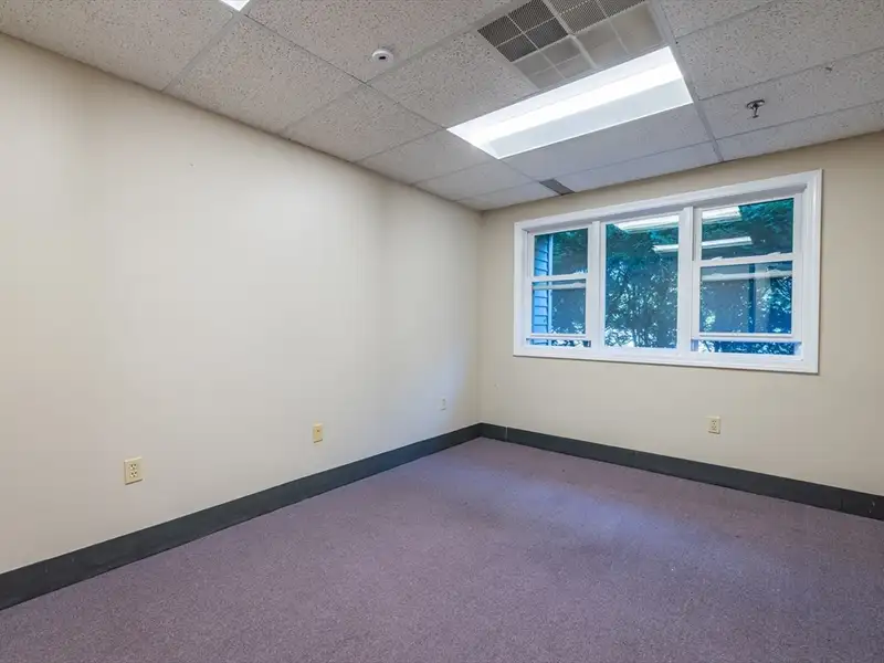 Freestanding Four-story Office Building with Parking on Route 114, North Andover