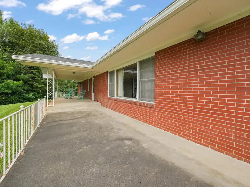 Prime 2.58-acre Multifunctional Property with Ranch Home and Outbuildings Near High-traffic Area