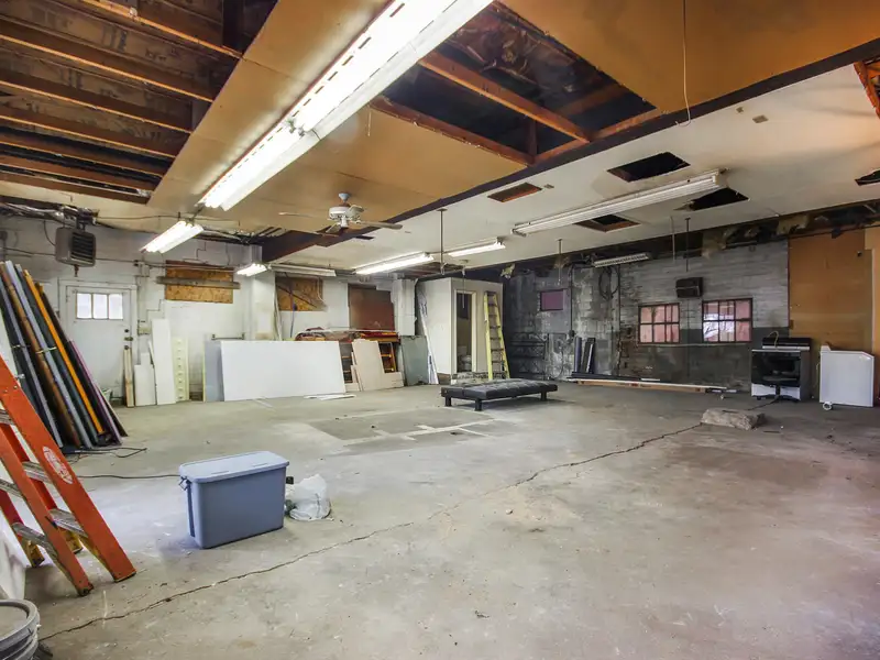 Mixed-use Two Unit Building with Remodeled Three Bedroom Apartment in Prime Location