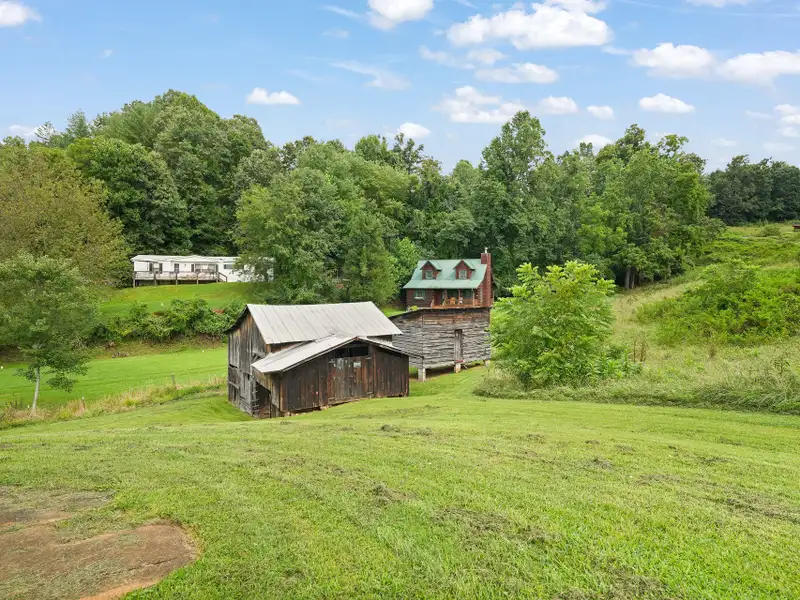 Prime 2.58-acre Multifunctional Property with Ranch Home and Outbuildings Near High-traffic Area