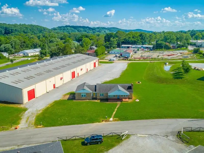 Versatile 33,880 Sf Industrial Warehouse with Income-producing Home in Cleveland, Tn