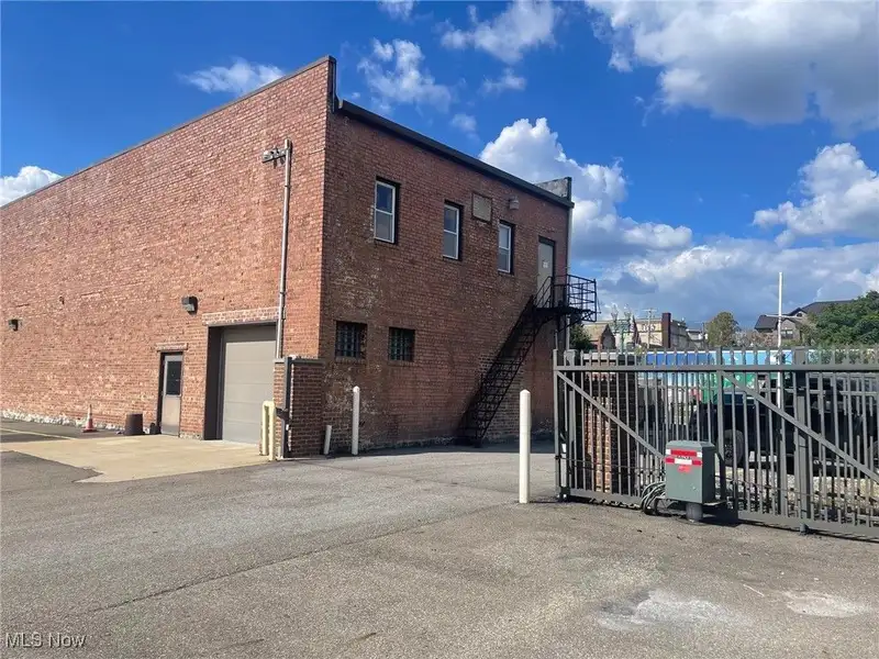 Well-maintained Two-story Brick Building with Retail and Workshop Space in Ne Location