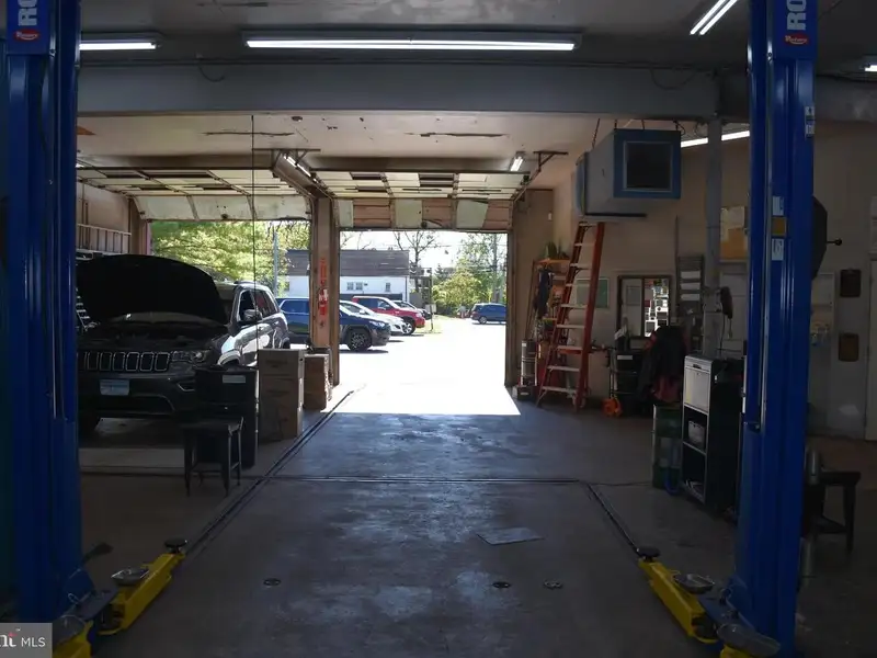 Versatile 3000+ Sq Ft Commercial Space in Prime Village Location with Auto Repair Facilities