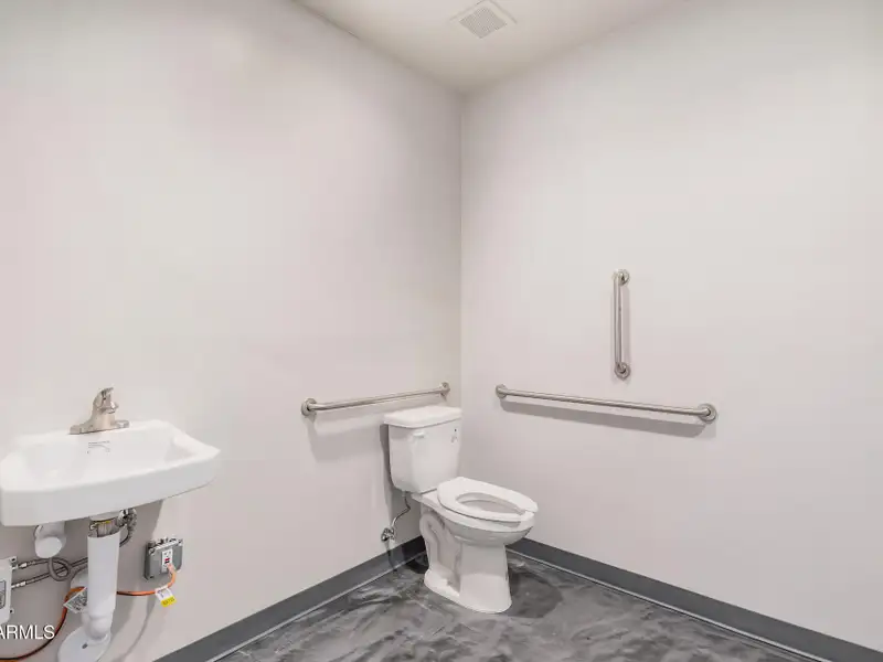 Versatile Commercial Property with Two Buildings and Ample Parking in Prime Location
