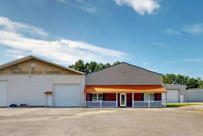 Commercial Property on Busy Highway - 2.1 Acres, 31,000 Sq Ft with Offices and Roll-up Doors