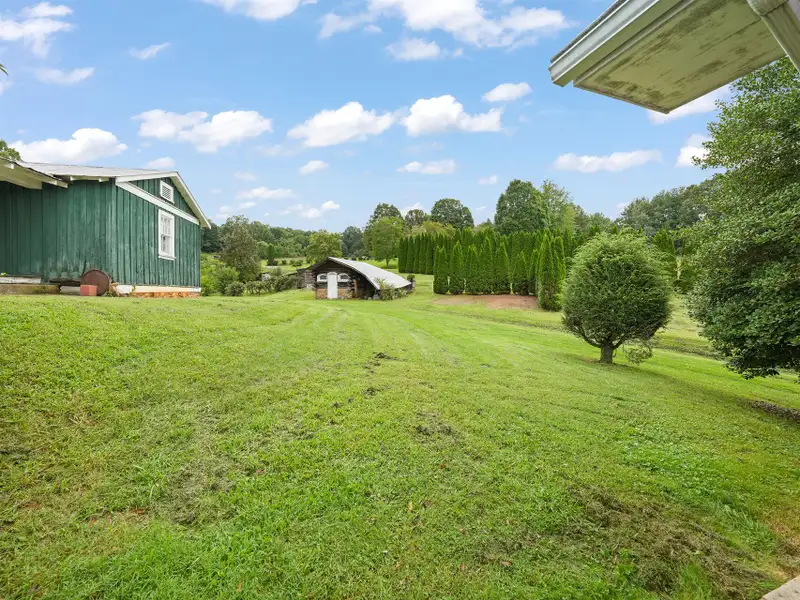 Prime 2.58-acre Multifunctional Property with Ranch Home and Outbuildings Near High-traffic Area