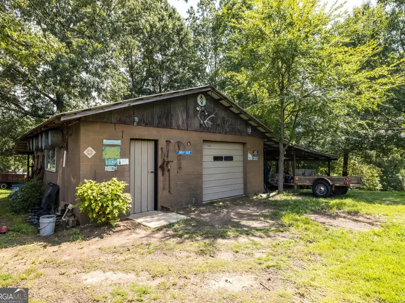 27 Acres with 2,400 Sq. Ft. Home, Duplexes, Pool, and Barn in Prime Location
