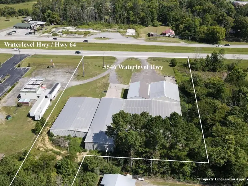 Commercial Property on Busy Highway - 2.1 Acres, 31,000 Sq Ft with Offices and Roll-up Doors