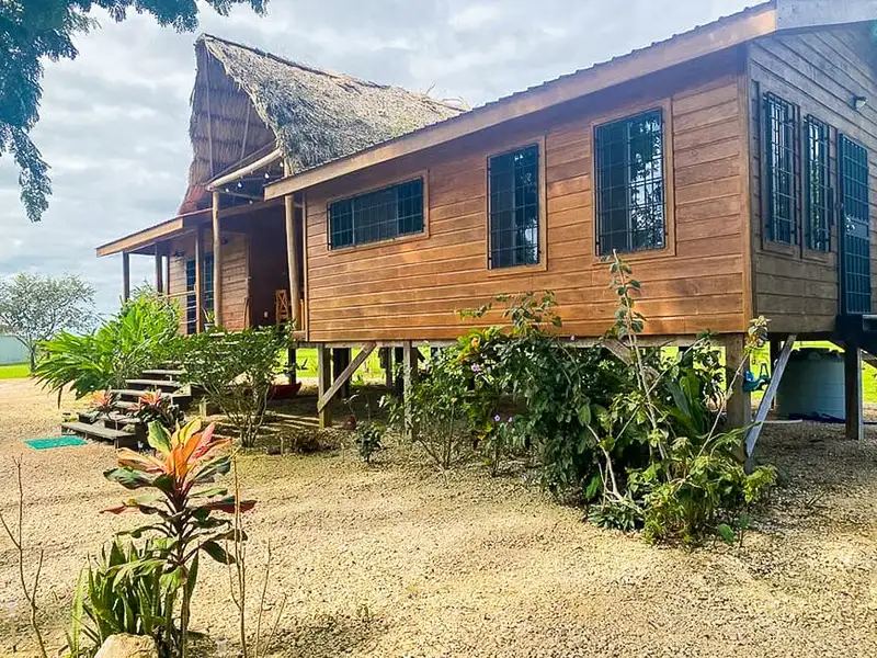 Riverfront 30-acre Farm with Sustainable Living and Rustic Main House in Belize