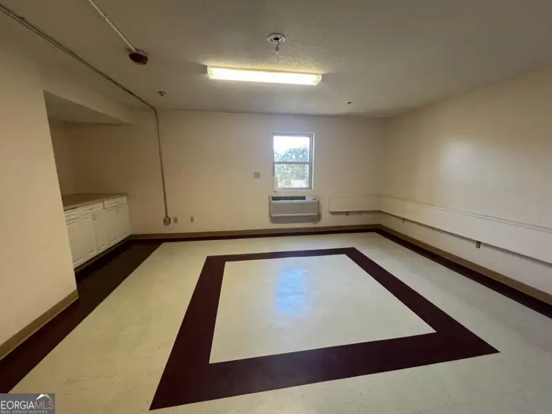 Two-level Commercial Unit with 26 Living/office Spaces in Re-zoned R4 Area