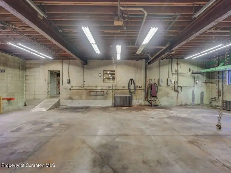 Mixed-use Property in Throop: 7-bay Garage and Updated 2-bedroom Apartment