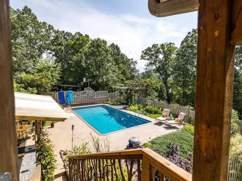 27 Acres with 2,400 Sq. Ft. Home, Duplexes, Pool, and Barn in Prime Location