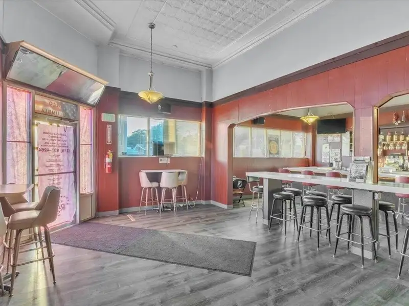 Versatile Corner Commercial Property with Retail Space and Two Apartments in Prime Location