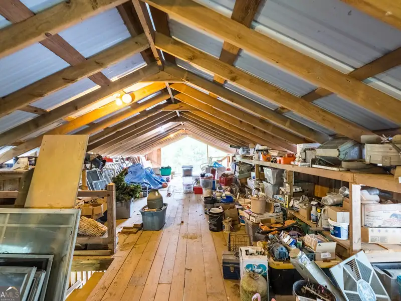 27 Acres with 2,400 Sq. Ft. Home, Duplexes, Pool, and Barn in Prime Location