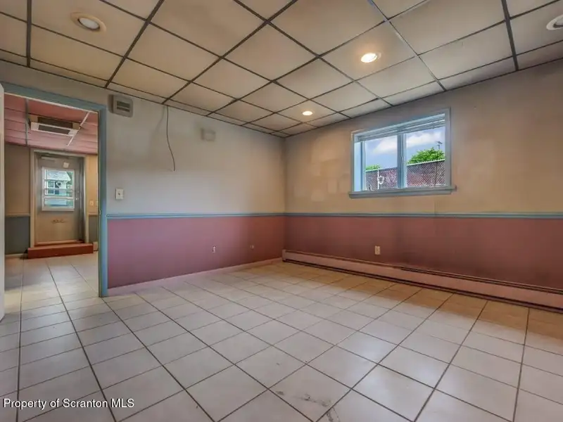 Mixed-use Property in Throop: 7-bay Garage and Updated 2-bedroom Apartment