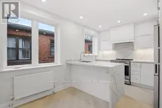 Renovated 2nd Floor Condo in Mid-town Toronto with Luxury Finishes and Modern Amenities
