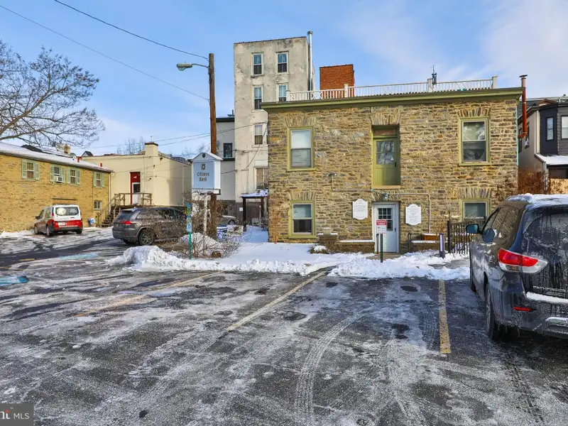 Historic Multi-use Building in Chestnut Hill Business District with Retail and Residential Units