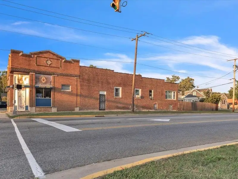 Versatile Corner Commercial Property with Retail Space and Two Apartments in Prime Location