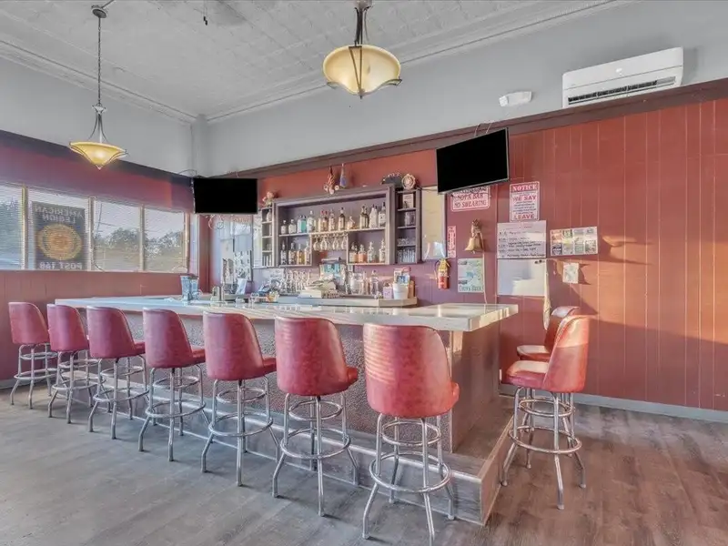 Versatile Corner Commercial Property with Retail Space and Two Apartments in Prime Location